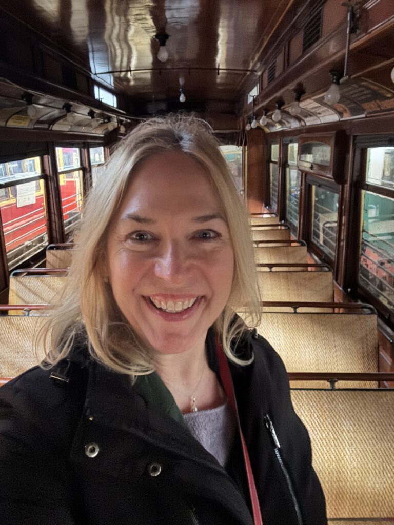 MSU Press Editor Elizabeth Demers inside the restored interurban car.