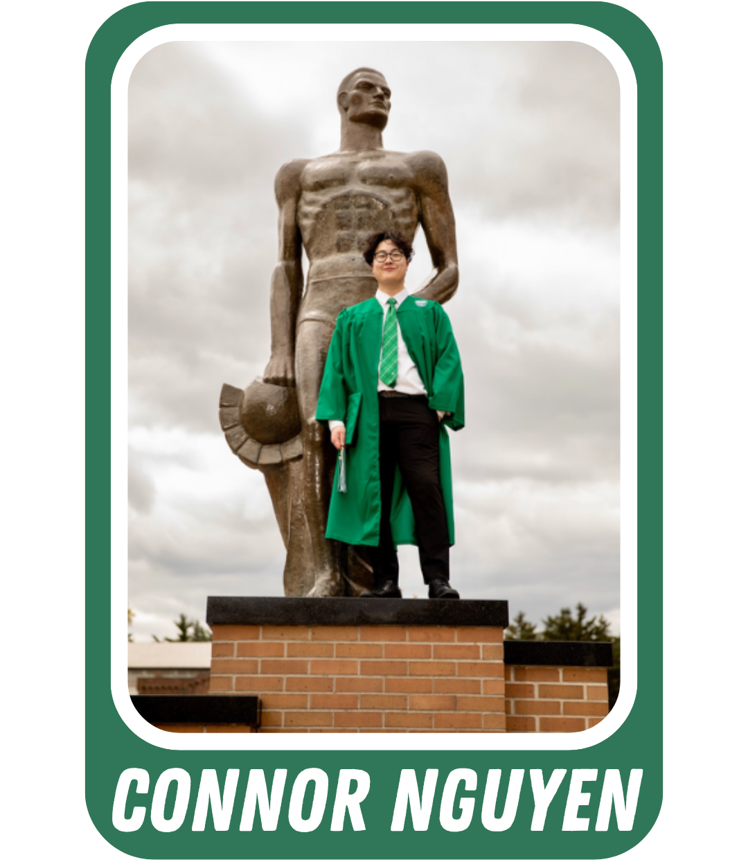 Graduation photo of Connor Nyugen next to Spartan Statue in green graduation gown. Caption text is "Connor Nguyen"