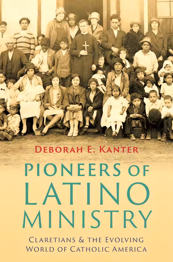 The Claretian missionary Joseph Puigvi pictured alongside Mexican residents of Clyde, Wisconsin.